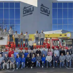OMU employees pose in front of customer service center